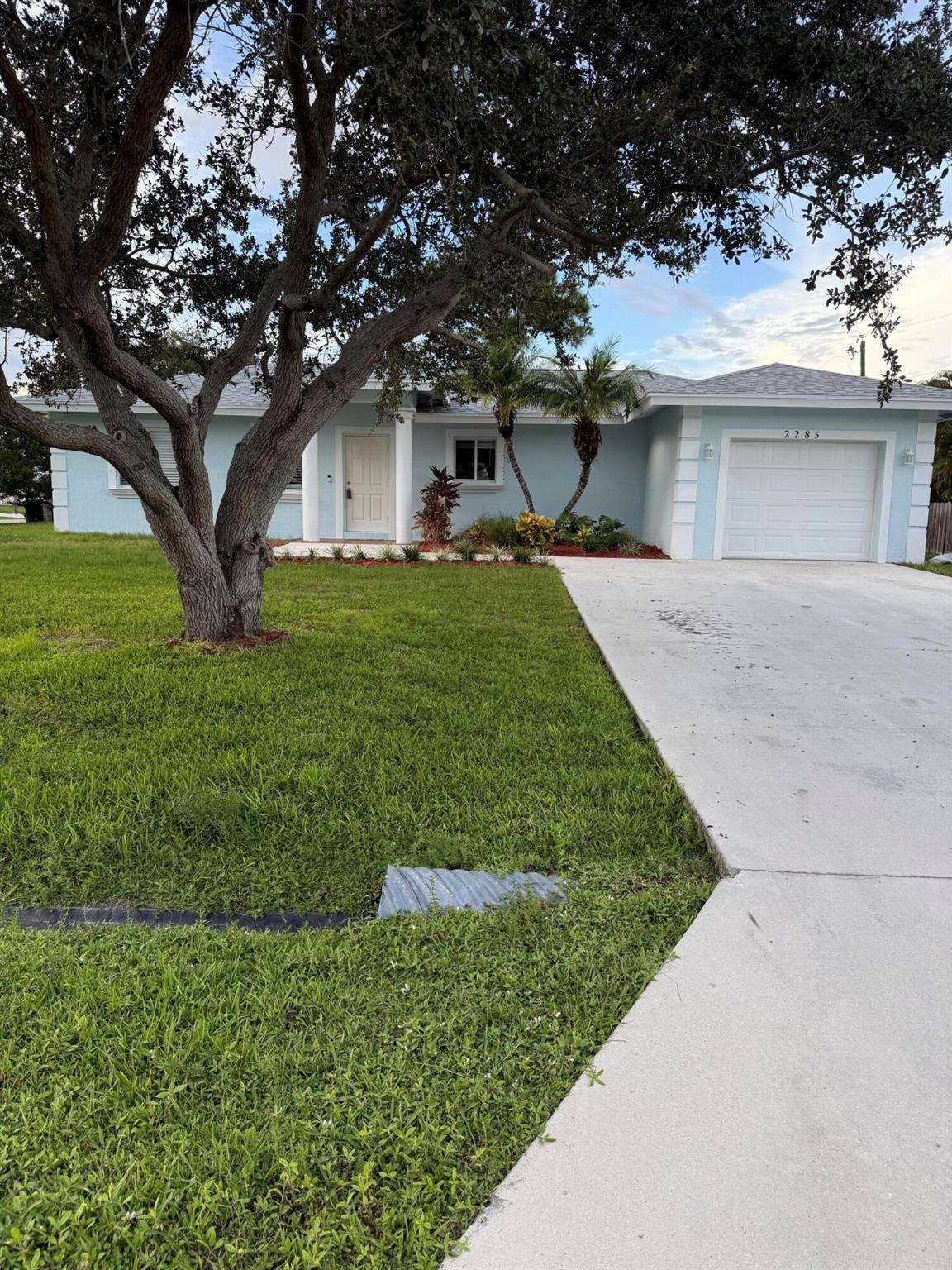 Newly completely renovated in 2024. Open layout. Freshly painted inside and out. Updated kitchen with granite countertops. Newly refreshed bathrooms.Enjoy year round outdoor living in the permitted 20X10 screened in patio with roof. Completely permitted.Brand new roof just installed.A beautiful three bedroom two full bath one car garage on a corner lot. This home is located east of US1close to beach and hospitals. Great neighborhood High ceilings . Bright living room. Huge master with walk in closet. Sliding glass doors. Split bedrooms. No HOA. Convenient access to Crosstown Parkway, US1 and nearby Shopping.