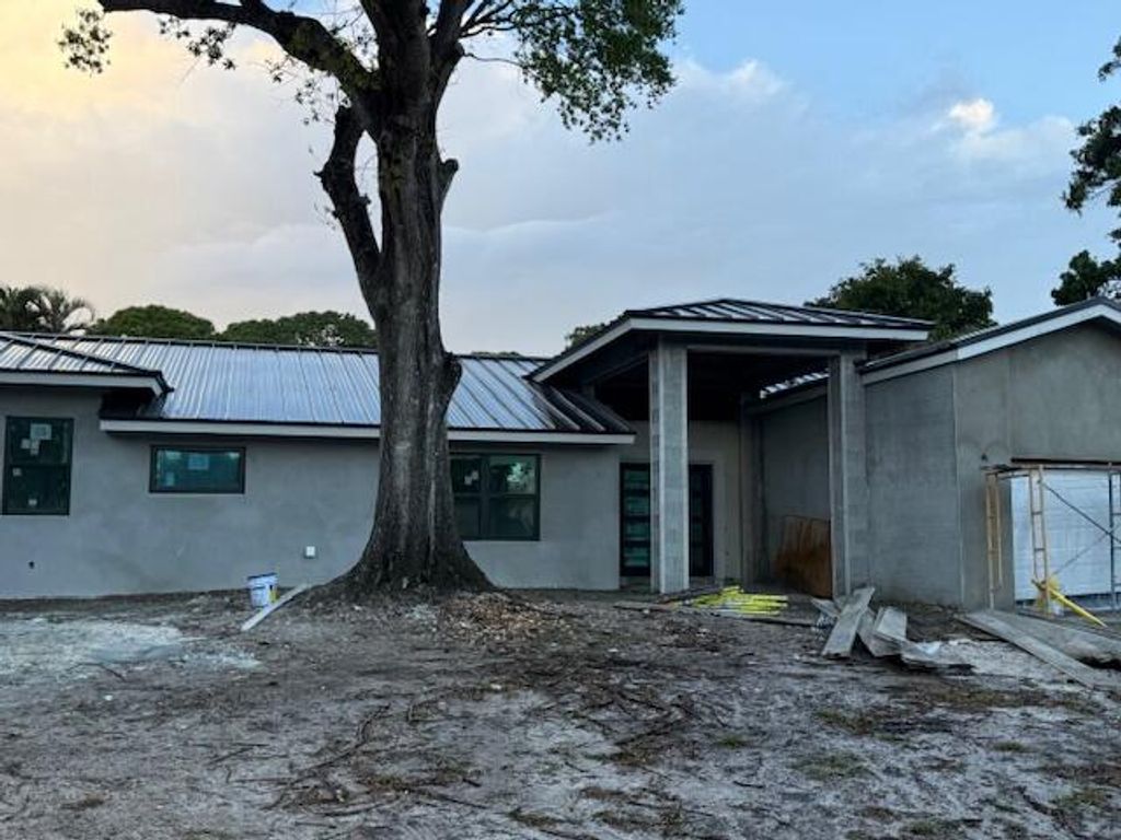 Photo of 4631 Cocoplum Way, Delray Beach, FL 33445 (MLS # R11168400)