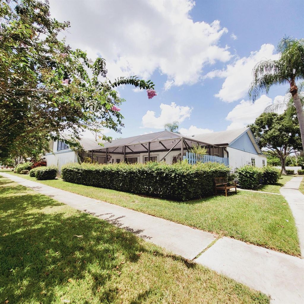 Photo of 2102 Timberlane Circle, Greenacres, FL 33463 (MLS # R11013553)