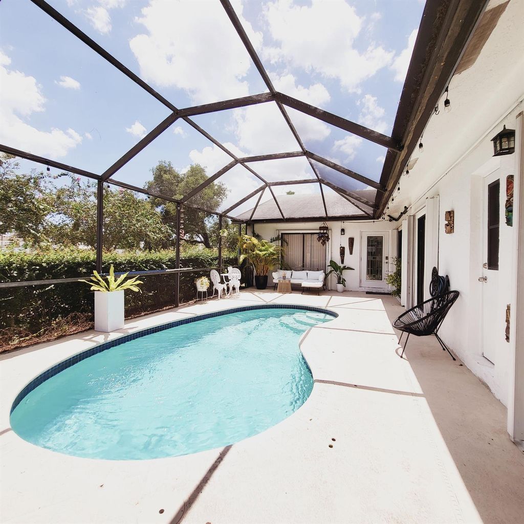 Photo of 2102 Timberlane Circle, Greenacres, FL 33463 (MLS # R11013553)