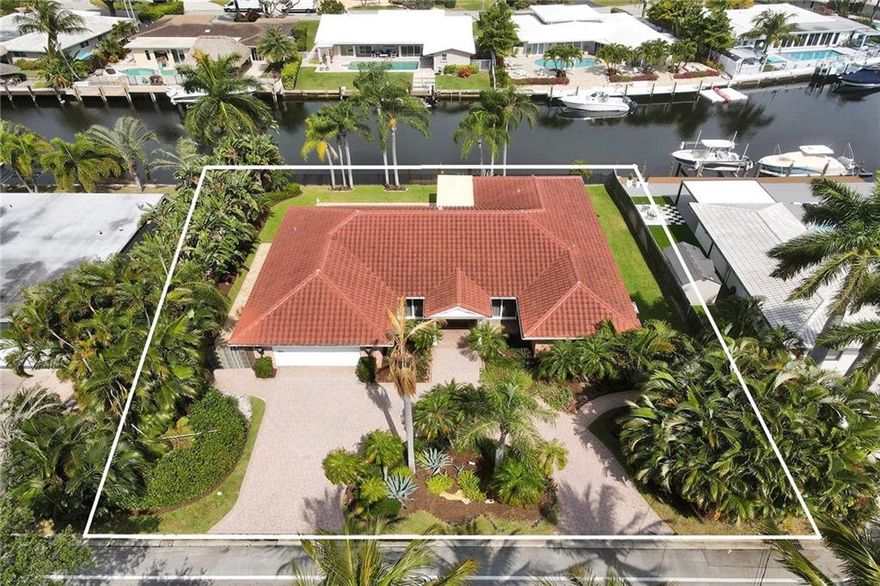 Fantastic 3 bedroom 3 bath waterfront home located in The Landings. 100’ waterfront with ocean access. Impact windows and doors! Bright and open living area with plenty of natural light. Kitchen boasts ample cabinetry with passthrough window to the pool area. Spacious bedrooms and baths. Big backyard with pool, covered patio, grass area and dock. Interior laundry room with storage. This home is situated on an oversized lot (100x110’). Close to dining, shopping and beaches.