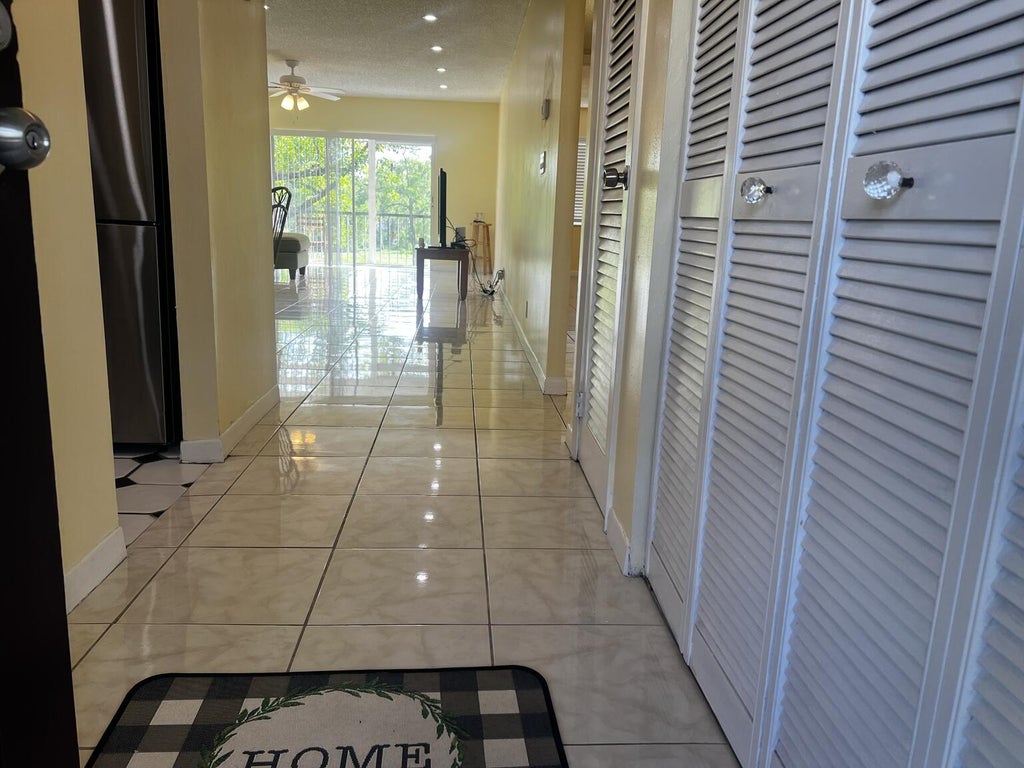 Photo of 6101 N Falls Cir Drive #310, Lauderhill, FL 33319 (MLS # B26042656)
