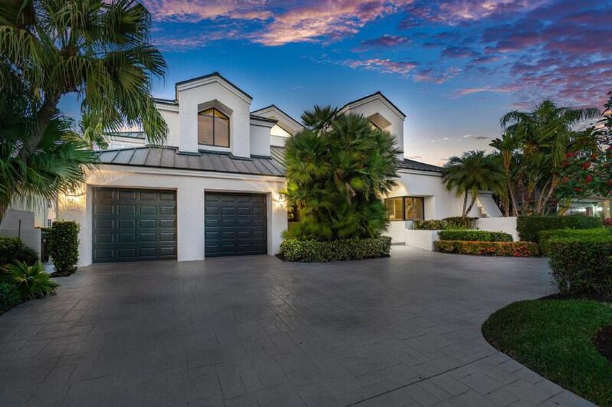 Absolutely stunning two story, 4BD/4BTH contemporary estate on a deep water, ocean access canal off the Intracoastal! Located in the desirable Tropic Isle neighborhood, this home offers 90 feet of waterfront and private pool and outdoor island grill providing a seamless flow for indoor-outdoor living. The coastal residence has been updated including, metal roof, impact windows and doors, full house generator with 1000-gallon propane tank, and 3 AC units (2019). Beautiful open and spacious design with vaulted ceilings and large windows, first floor primary bedroom. Plenty of parking with the two car garage, plus large roundabout driveway. Iris Drive is one of the best streets in Tropic Isle! Come see this beauty before it's gone.