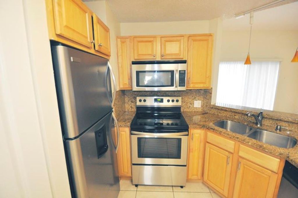 Photo of 3409 NW 44th Street #205, Lauderdale Lakes, FL 33309 (MLS # B26037790)