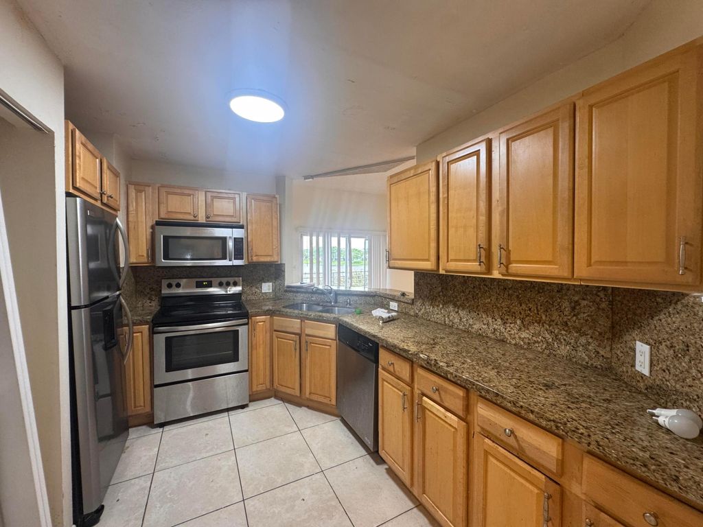 Photo of 3409 NW 44th Street #205, Lauderdale Lakes, FL 33309 (MLS # B26037790)