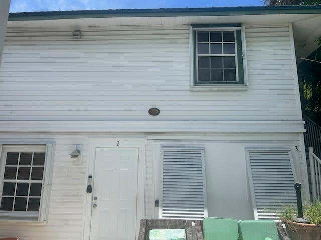 Welcome to this charming 2 bedroom 1 bath 1925 Key west style home in the heart of Grandview Heights historic district. Great location and just minutes from downtown West Palm Beach and sandy beaches. Brand new 2025 standard size washer and dryer in unit. Large jacuzzi and bbq grills to use as you please. Furniture negotiable- Can be rented furnished or unfurnished. First, last, and security deposit required. This unit is located behind main house. This opportunity will wont last!