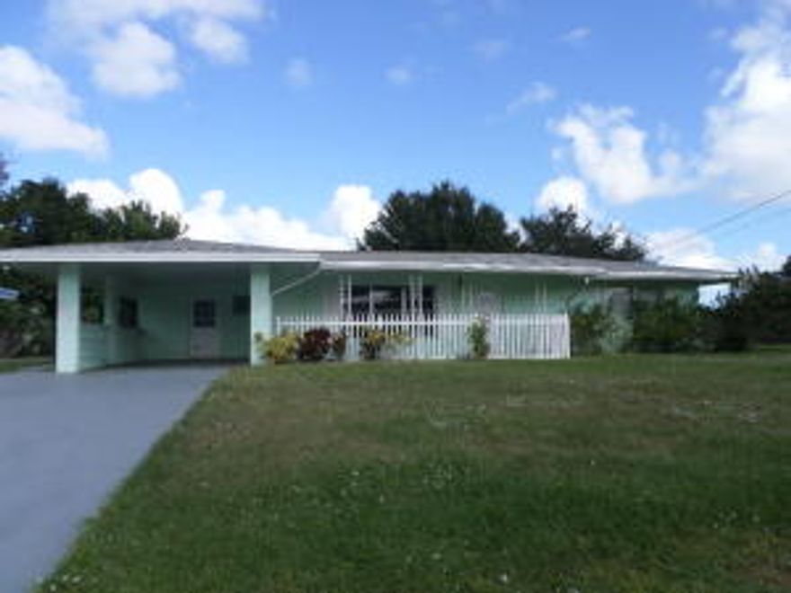 Plenty of room to spread out in this 3/2 concrete block home in Orange Blossom Estates. Open, tiled living area, large family room, freshly painted and new carpet in the bedrooms.  Relax and watch the world go by on the open front porch area. Plenty of yard for family fun and backyard BBQ's. Tiled laundry room off the carport.  Conveniently located close to hospital, restaurants, shopping and beaches.  Come and enjoy all that the Treasure Coast has to offer with great weather and year round fishing and boating.  St Lucie County is home to miles of unspoiled beaches, many parks and recreational areas offering hiking and preserves, museums, theatres, ball fields and much more.  A great home in a great location... Hurry, this one won't last! Measurements are estimates, please verify.