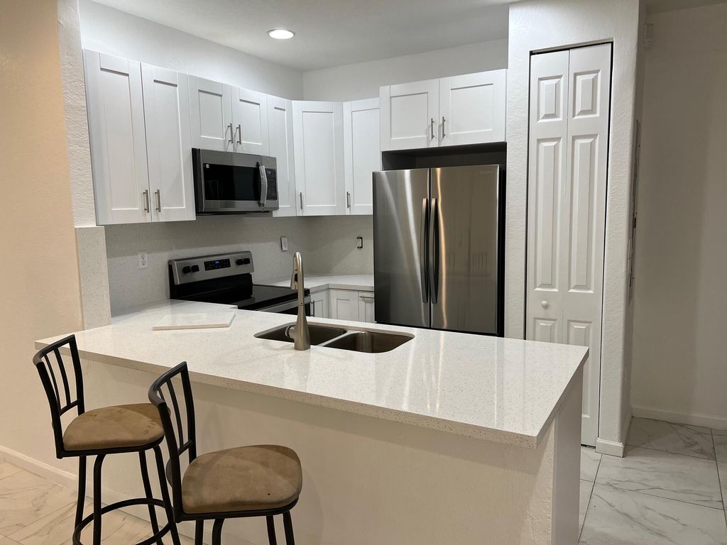 Photo of 408 Lake Monterey Circle #408, Boynton Beach, FL 33426 (MLS # R10949238)