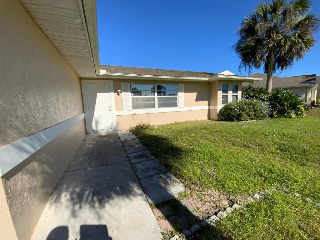 Photo of 971 SW Kappa Avenue, Port Saint Lucie, FL 34953 (MLS # R10951017)