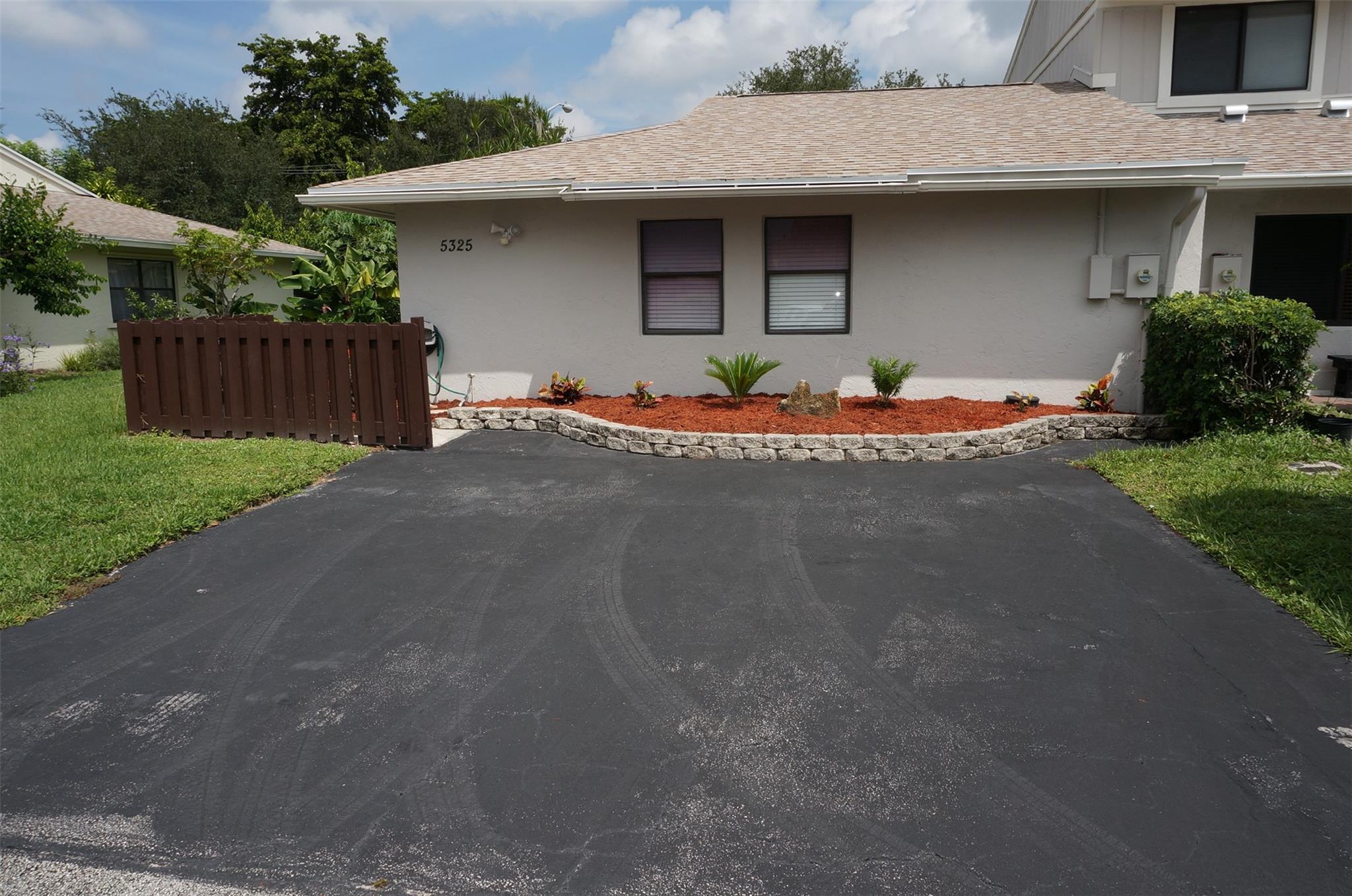 Welcome to this beautifully maintained 2-bedroom, 2-bathroom villa located in a serene and quiet community, ideally situated in a highly desirable area belonging to the Boca Raton school district.
This charming home features tile flooring throughout the main living areas for easy maintenance and a modern feel, while the bedrooms are adorned with wood-look laminate flooring for a warm and cozy touch. The kitchen offers a clean, contemporary look with crisp white cabinetry, striking black granite countertops, and sleek black appliances—perfect for home cooks and entertainers alike.
Enjoy the comfort of central A/C, ample natural light, and a functional layout that offers both space and privacy. The community is peaceful yet conveniently located near shopping, dining, and major highways