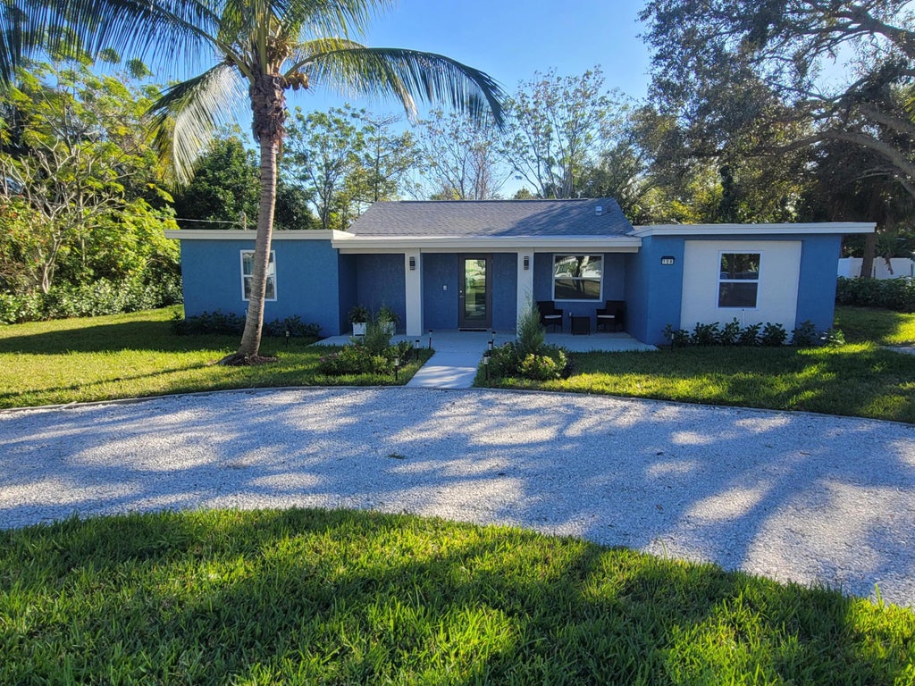 Photo of 106 E Chandler Road, West Palm Beach, FL 33406 (MLS # B26058505)