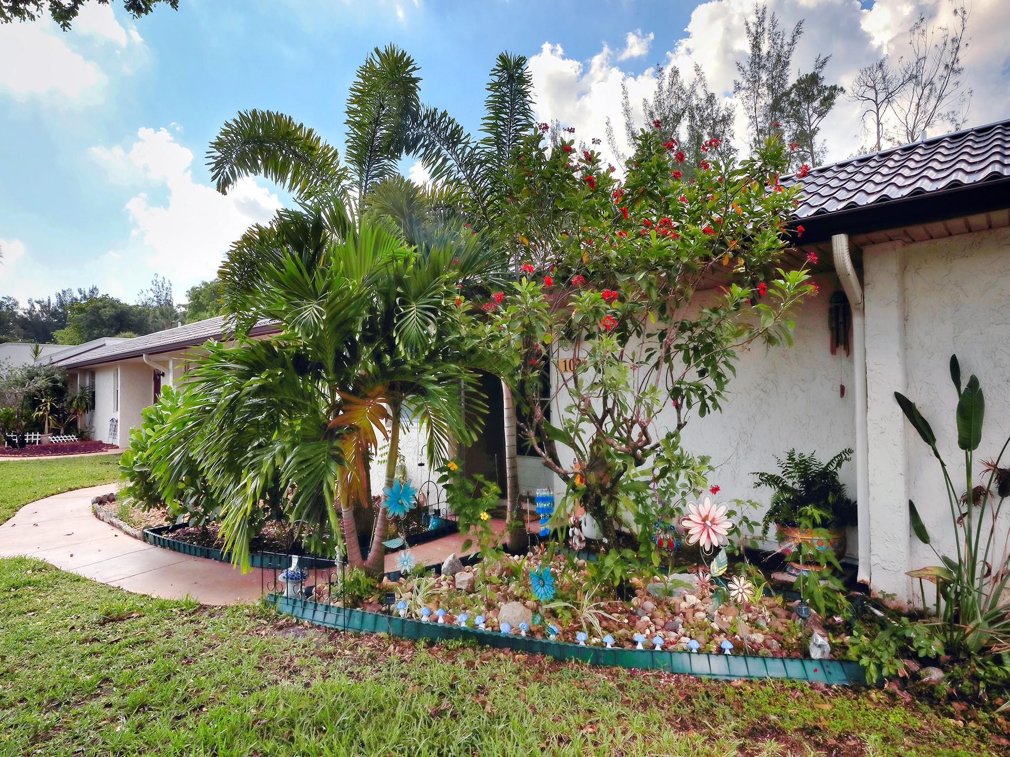 Every once in a while, a property comes on the market that checks ALL the boxes. Meticulously maintained one story villa, completely updated from floors to ceilings. BRAND NEW ROOF (2024), remodeled kitchen with custom wood cabinets, granite counter tops & stainless steel appliances. Kitchen wall opened to dining & living area with extra cabinets. Both bathrooms remodeled & primary bathroom is in suite to the extra large bedroom with walk in closet. Florida room with hurricane impact glass (throughout villa) opens to VERY private back yard with garden & water views. Washer & dryer in unit. This elegant over 55 community accepts pets (up to 30 pounds) & offers the most amazing amenities. Your shaded parking spot is directly in front of your villa. See all the rest then come see the best!