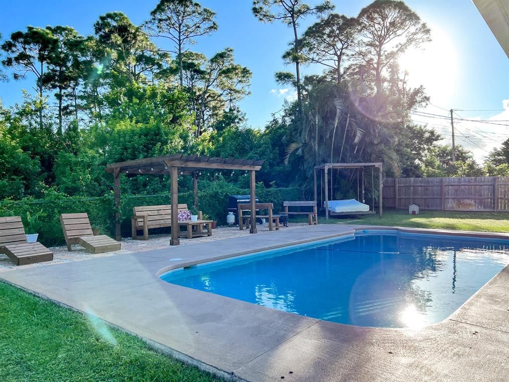 Photo of 1522 SW Apricot Road, Port Saint Lucie, FL 34953 (MLS # R10751897)