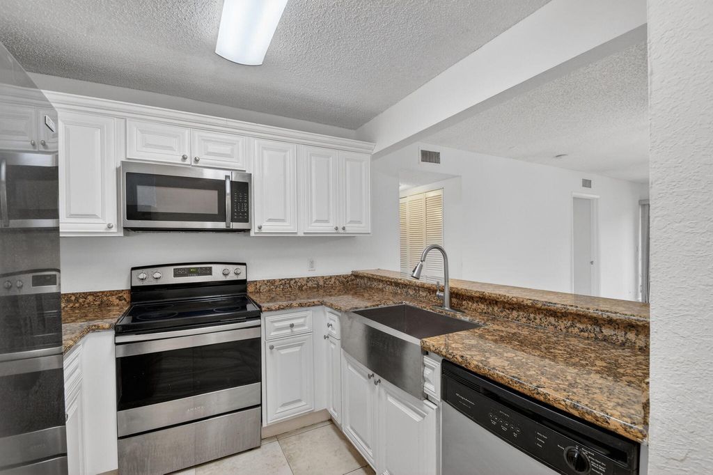 Photo of 1681 Balfour Point Drive #F, West Palm Beach, FL 33411 (MLS # B26026551)