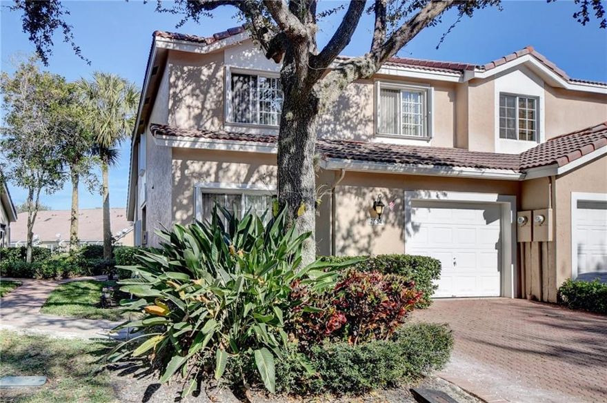 Back on market!  Rarely available immaculate 3 BR 2.5 Bath w/loft, end unit with private entrance, tranquil water views & vaulted ceilings. Large 2nd floor loft could be converted into 4th bedroom and huge 2nd floor storage area could be converted to craft room, work space or other. Downstairs primary suite w/large closet and upgraded primary bath and powder room. Beautiful kitchen with granite and gorgeous laminate flooring on stairs, 2nd floor loft and bedrooms. Sliding glass doors lead to private screened porch overlooking lake w/fountain for privacy and quiet. Unit is located very close to community pool. HOA maintenance covers ext. painting, lawn maint. and roof maint. 2021 A/C unit w/ability to transfer A/C warranty w/9 years+/- remaining. Accordion shutters throughout.