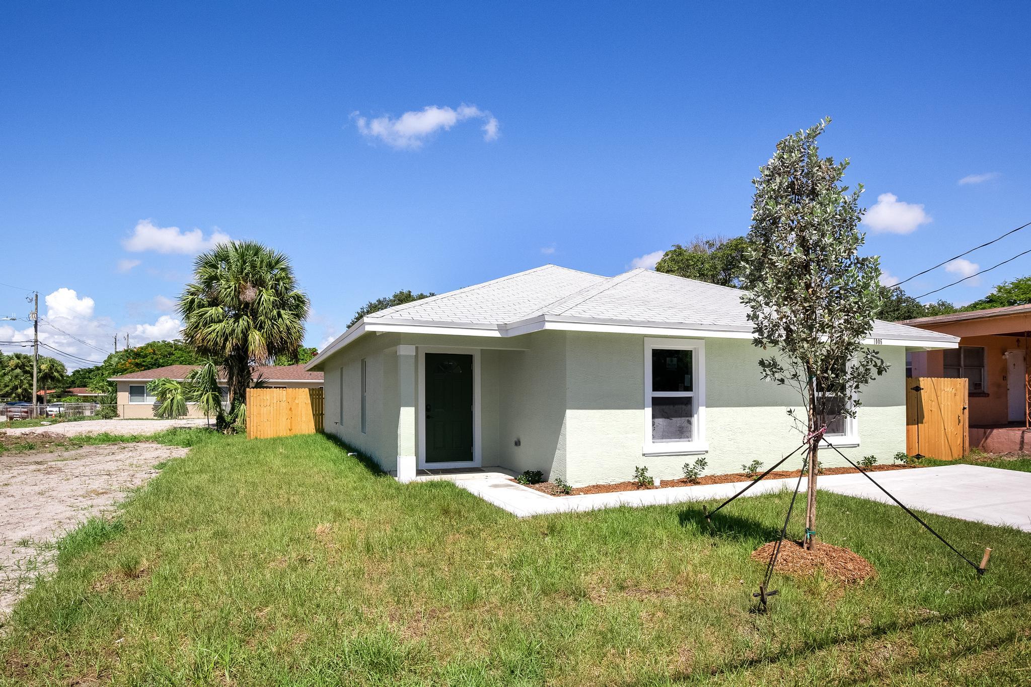 Recent resale of NEW CONSTRUCTION of this CBS Home with 3 bedrooms, 2 bath, 13 FOOT CEILING in the main living space and large open floor plan.Beautiful Kitchen with granite countertops, stainless steel appliances, white shaker cabinets. IMPACT WINDOWS, NO HOA, good size laundry room, patio with large fenced in backyard and oversized front yard with a paved driveway.Great location close to I95, Palm Beach outlets, downtown West Palm Beach, golf, beaches and restaurants.