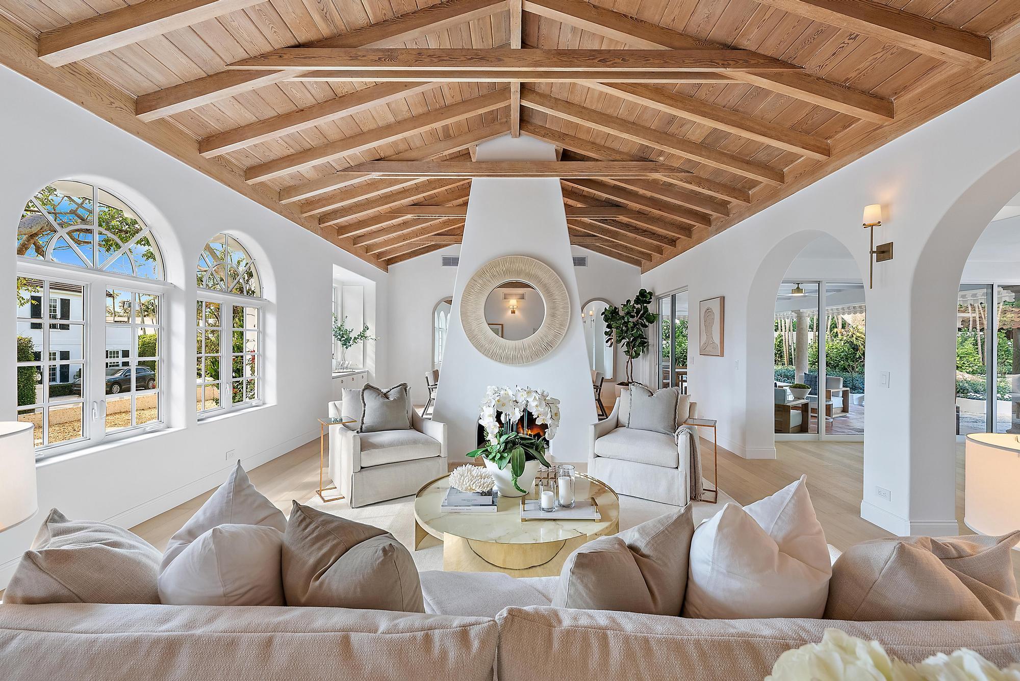 This exquisite Montecito-style home, situated at a prime ~ 21-foot elevation, boasts expansive views that enhance the serene atmosphere. Newly remodeled with meticulous attention to detail, this 4-bedroom, 4-bathroom residence blends elegance and modern luxury. High ceilings throughout create an airy, open feel, while premium finishes and design choices are evident at every turn. Inside, a free-standing fireplace separates the living room from the dining area, drawing attention to the exposed beam ceilings and impressive volume. The newly installed white-oak hardwood floors lead to the luxurious primary bedroom suite, where Pecky Cypress ceiling creates a warm, inviting ambiance. The large Chef's kitchen is a culinary dream, featuring stunning marble countertops, a Wolf gas stove