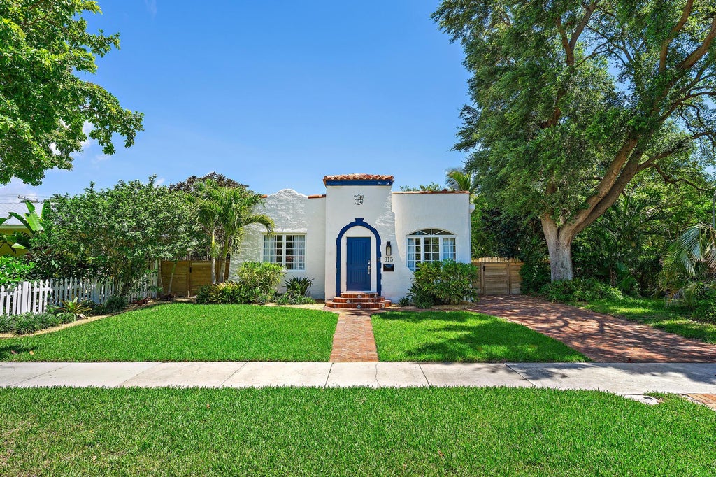 Photo of 315 Hawthorne Drive, Lake Park, FL 33403 (MLS # B26039292)
