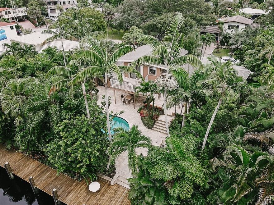 This classic Mid Century tri-level waterfront home is conveniently located in a quiet cul-de-sac, minutes from downtown and I-95. With 85ft of dock, ocean access and no fixed bridges, this property has it all! Amazing outdoor space on three different deck levels, large pool and lush landscaping for privacy. Indoors is spacious and bright with wood exposed beam ceiling and sliding doors opening to an expensive deck. The terrazzo floor has been kept in excellent condition. Separate laundry-room and one car garage. Furniture negotiable.
