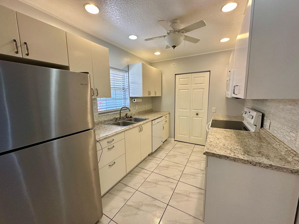 Photo of 14047 Wellington Trace, Wellington, FL 33414 (MLS # R10955089)