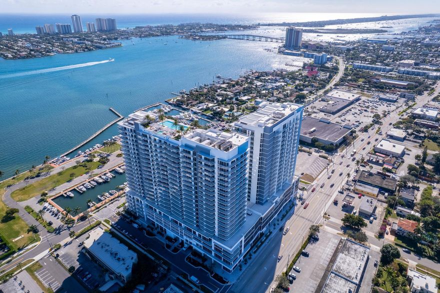 This gorgeous new construction waterfront condo offers bright, easy living with stunning Intracoastal views. Flooded with natural light through floor-to-ceiling glass, the residence features high-end finishes, a clean modern design, and a layout that's perfect for enjoying South Florida's mild winters and relaxed coastal lifestyle. Inside, you'll find 10' ceilings, porcelain tile floors, a sleek kitchen with quartz waterfall countertops, premium Miele appliances, European cabinetry, and induction cooktop. Spa-like baths include a freestanding soaking tub, full-height tiled shower, and floating vanities, while smart-home-ready features make this a true lock-and-leave home.
The building's amenities rival those of a luxury resort, with multiple (rooftop) pools, cabanas, spa, fitness and wellness spaces, bowling alley, golf and sports simulator, movie theater, club and lounge areas, and even spaces for kids and teens. The building allows 2 pets and leasing once a year. Additional conveniences include valet service, garage parking, concierge, and on-site waterfront dining at SeaHawk Prime by David Burke. Walk out to the waterfront promenade or enjoy private beach club access on Singer Island. Perfectly located close to shopping, dining, and golf, just 10 minutes to the beach and about 20 minutes to downtown West Palm Beach and PBI. This is effortless waterfront living at its best.