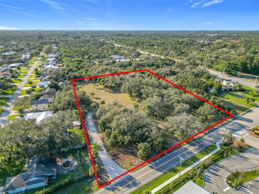 Beautiful 3.64 acres, zoned General Commercial. Just two parcels in from Oslo on Old Dixie Hwy. Close to US1. Center of the property has been cleared. The perimeter of the property has beautiful Oaks. Driveway with gate. The property also has temporary power and water available. Partial sidewalk. Awesome location close to US Hwy 1. Oslo Rd is scheduled to open to I-95 in the summer of 2027.