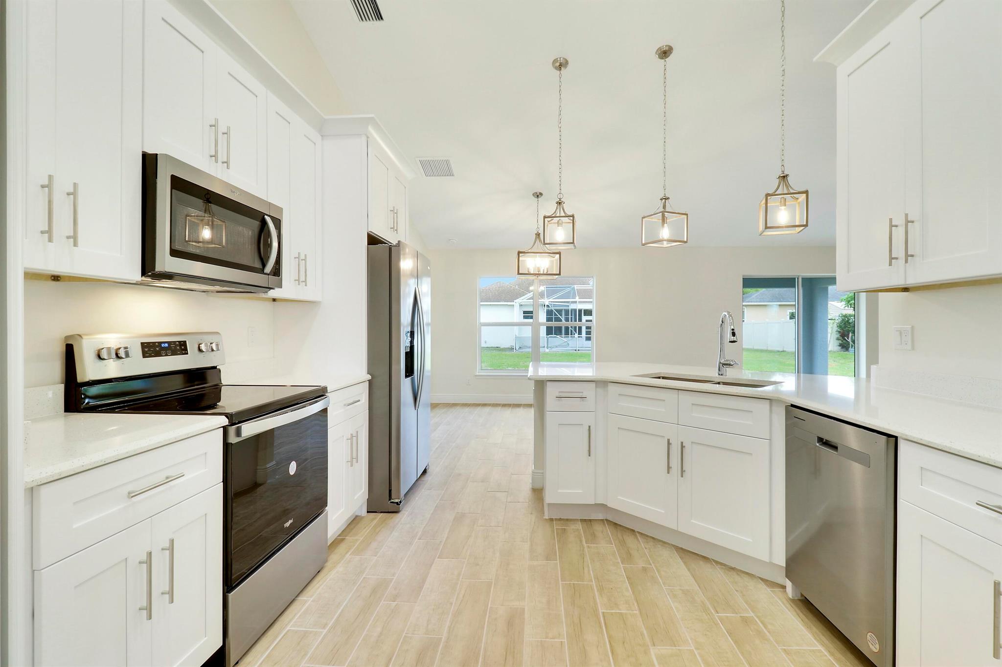 Brand new construction 4 bed, 2 bath home in Torino. Wood-look tile throughout (no carpet), Quartz counters in kitchen and both baths, soaking tub in primary suite with separate shower, stainless steel appliances and no HOA. Large walk in closet in primary suite and built in closet shelving in all closets. Close to all of the shops and restaurants of St. Lucie West, Mets Spring Training at Clover Park, and the dog park and pickle ball courts at Winter Lakes.