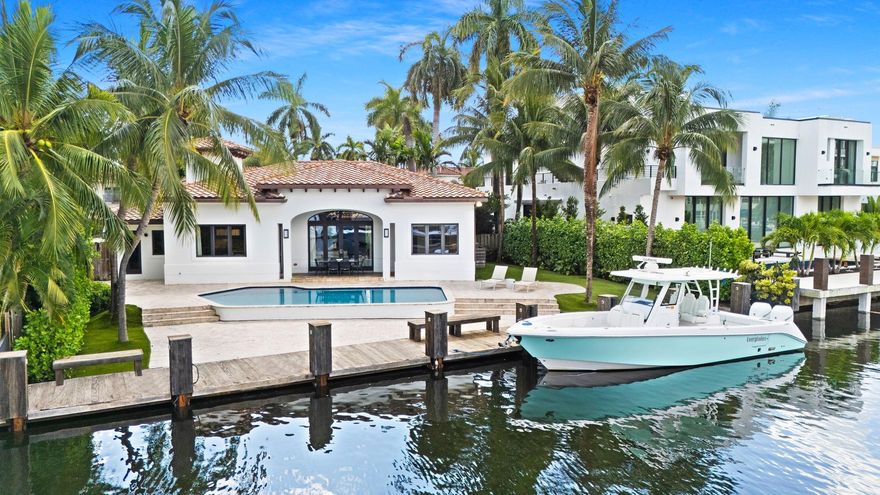 Discover 49 Fiesta Way, a meticulously renovated four-bedroom ranch home on one of the most coveted streets along the Las Olas Isles. No need to renovate, as all major components have been updated - so you can enjoy more time on the water, at the pool or on the beach. Appreciate an 85' dock, no fixed bridges, and quick ocean access. Inside, find a perfect blend of style and functionality. The chef's kitchen is a culinary delight with a Subzero fridge and gas Wolf range, adorned with wood floors and vaulted ceilings featuring decorative beams. Fiesta Way offers underground powerlines, eliminating the need for generators and enhancing the picturesque surroundings. 
Minutes from the beach and iconic Las Olas Blvd offering many dining, shopping, and nightlife experiences.
This is a must-see.
