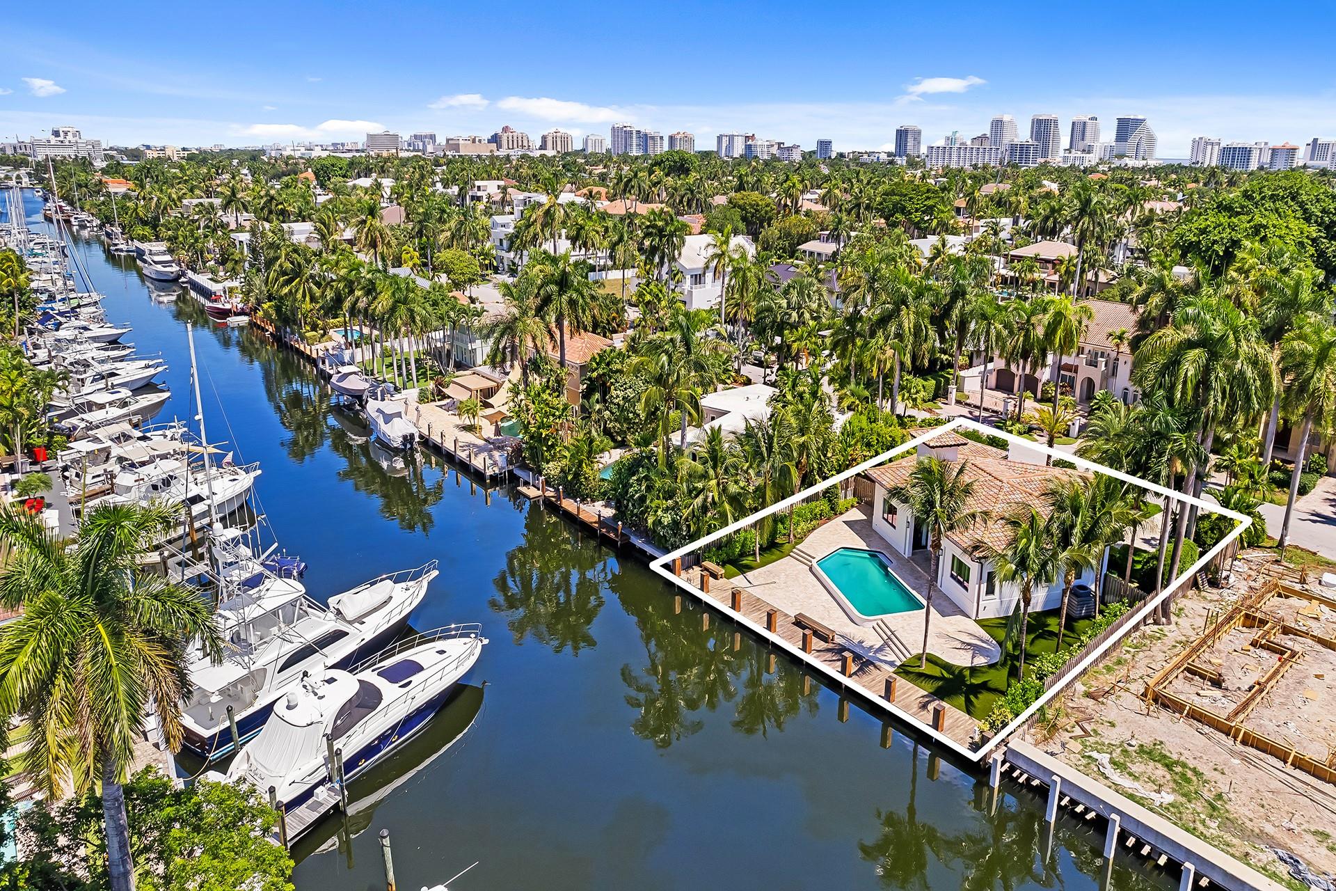 Discover 49 Fiesta Way, a meticulously renovated four-bedroom ranch home on one of the most coveted streets along the Las Olas Isles. No need to renovate, as all major components have been updated - so you can enjoy more time on the water, at the pool or on the beach. Appreciate an 85' dock, no fixed bridges, and quick ocean access. Inside, find a perfect blend of style and functionality. The chef's kitchen is a culinary delight with a Subzero fridge and gas Wolf range, adorned with wood floors and vaulted ceilings featuring decorative beams. Fiesta Way offers underground powerlines, eliminating the need for generators and enhancing the picturesque surroundings.
Minutes from the beach and iconic Las Olas Blvd offering many dining, shopping, and nightlife experiences.
This is a must-see!