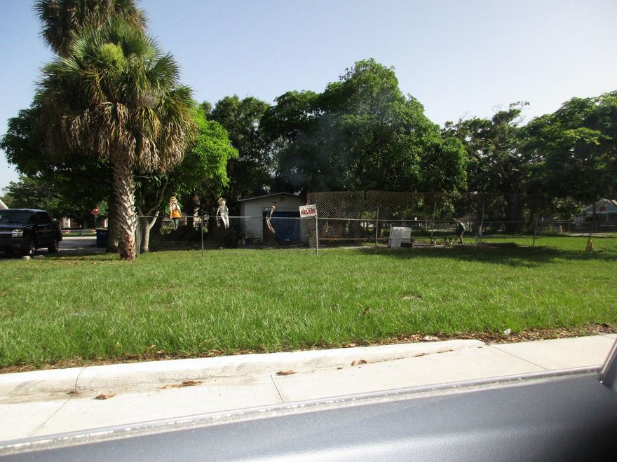 Spacious corner lot with possible split into 2 single family homes sites to build 2 residences. Buyer must confirm with St. Lucie Planning and Zoning. Buyer to assume responsibility to check for availability of public water and sewer and Power services for property. However, in past a SF home occupied the property and there is currently a garage on site that does not meet code and most likely will need to be razed. There is reportedly a sustancial credit for impact fee redemption.Buyer to confirm building restriction and setbacks with St Lucie Cty Planning and Zoning. Buyer to confirm availability for Public Sewer and Water @ Ft Pierce Utilities
