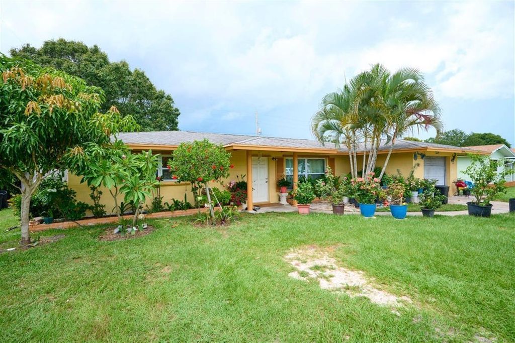 Photo of 4044 Greenwood Dr, Fort Pierce, FL 34982 (MLS # F10397561)