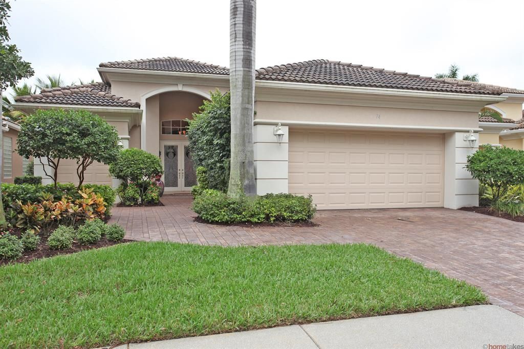 Photo of 74 Laguna Drive Dr, Palm Beach Gardens, FL 33418 (MLS # R10809297)