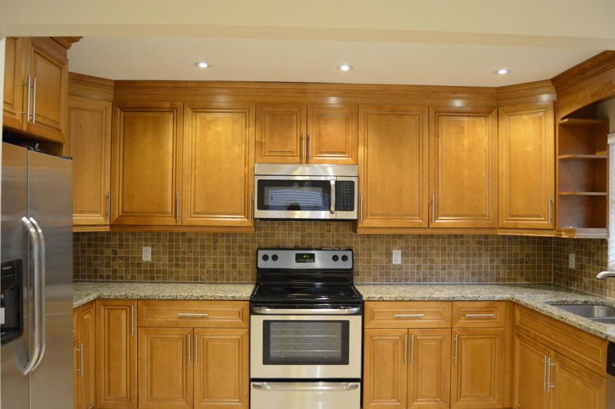 Do you have a pickup truck, small boat...? No problem! You can rent this beautifully upgraded 2/2 apartment on Ocean Ave, walking distance to the beach, restaurants, stores. Freshly painted apartment & whole building. Central brand new A/C unit. The kitchen has new wood cabinets, granite counter tops, new stainless steel appliances. Each bedroom has walk-in closet. Bathrooms are upgraded as well with new cabinets, vanities...Crown moldings, new blinds, neutrals ceramic titles in whole apartment. Hi hats with LED lights in living room & kitchen,  water heater & appliances let you save on energy. Laundry room for 2 units is located at the back of the building in separate entrance. You must see to appriciate!