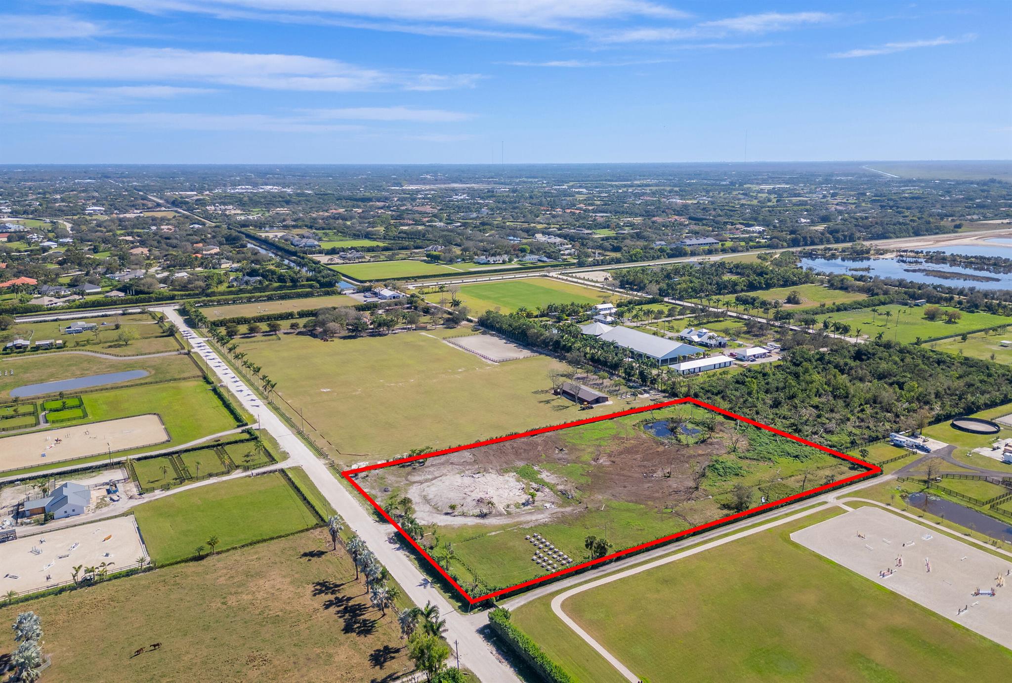 Rustic Ranches is an Idyllic subdivision of Wellington and the new chosen location for Equestrians. This property is Ideally located for Easy Hack to the Horse Show and is the closest of all offered properties to the land bridge for Equestrians, a short drive to Publix and Tractor Supply and minutes to Wellington Nature Preserve. NO HOA, CITY Water, Ag Exemption in place. Seller Financing available for easy access for Creating your Ideal Home and Farm. Manifest your dream farm with everything desired surrounding you for your serene equestrian lifestyle.Previous home was lost in Tornado but the Pad and electric and water already connected and run to the pad, Septic in place etc....Property is clearedBuild your dream farm!