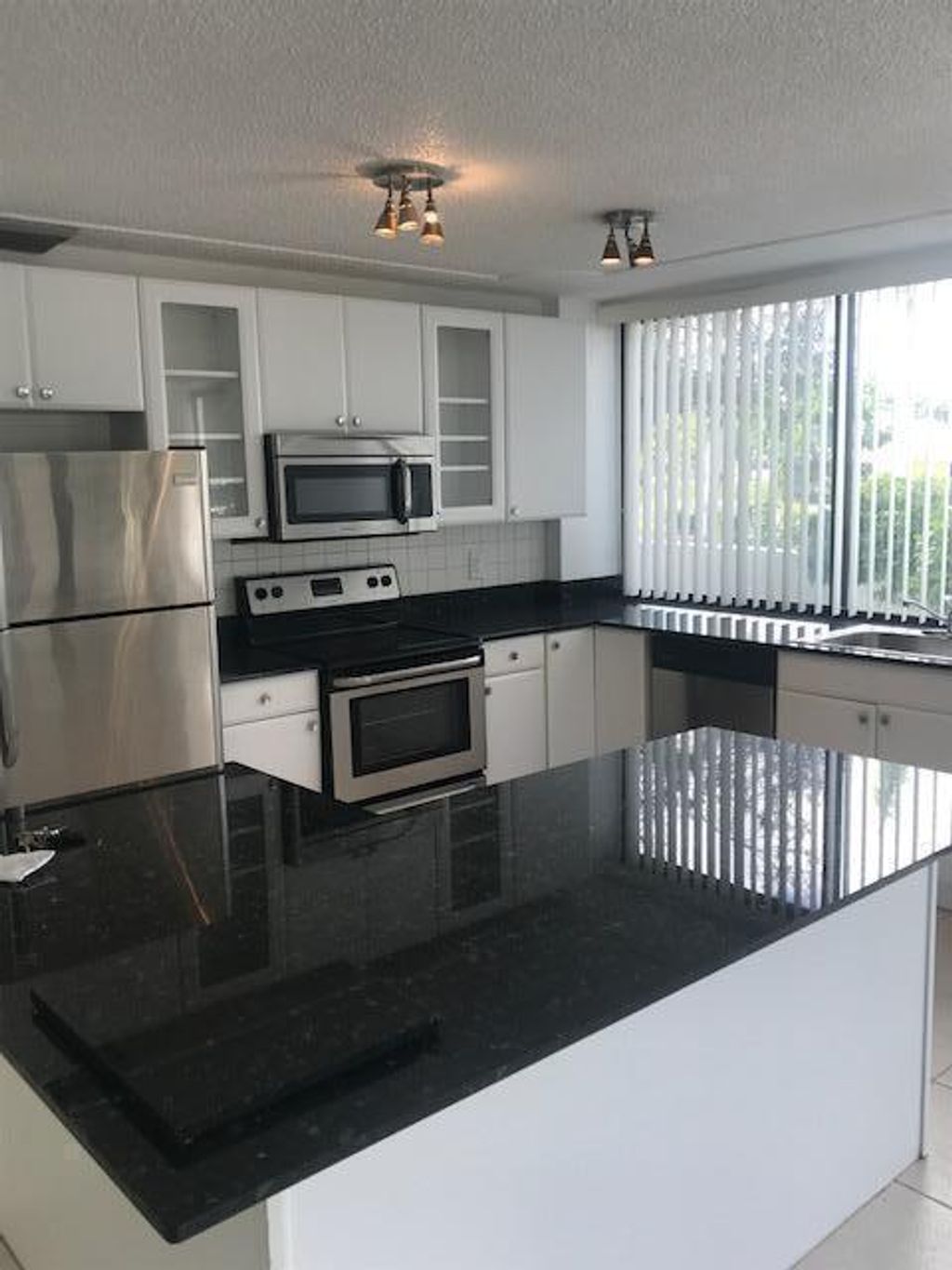 Photo of 1500 Presidential Way #103, West Palm Beach, FL 33401 (MLS # R11006087)