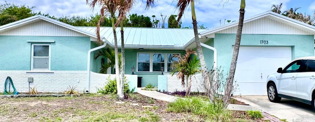 Photo of 1703 NE 25th Terrace, Jensen Beach, FL 34957 (MLS # B26008095)