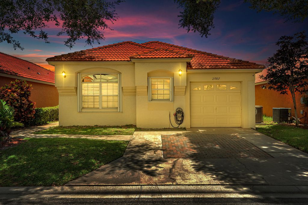 Photo of 2087 Bonisle Circle Cir, Riviera Beach, FL 33418 (MLS # R10814382)