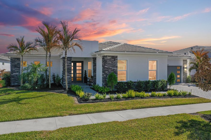 Discover 10639 SW Vineyard Drive in Port St. Lucie, FL, a beautifully designed 2023 single-story home in Seville at Tradition offering 3 bedrooms, 2.5 bathrooms, 2,809 living square feet, impact windows and doors, and a 3-car garage. The popular Conrad floor plan features open-concept living, a spacious kitchen with island and pantry, a versatile flex room, and a private primary suite with dual sinks and a large walk-in closet. Enjoy modern construction, stylish finishes, and the sought-after Tradition lifestyle close to shopping, dining, and everyday conveniences. Loaded with upgrades, this stunning 2,809-square-foot single-story Conrad in Seville at Tradition offers luxury, resilience, and effortless Florida living. Featuring 3 bedrooms, 2.5 bathrooms, a private owner's suite, dedicated guest wing, versatile flex room, and corner sliding doors with beautiful lake views, this home blends comfort and style throughout. Built with insulated concrete form exterior walls and hurricane-impact windows and doors, it offers exceptional peace of mind. Owner-added upgrades include matching ceramic tile throughout, plantation shutters, upgraded lighting, perimeter fencing, security system with cameras and sensors, a motorized retractable lanai screen, and an enhanced kitchen with wood cabinetry, soft-close doors and drawers, cabinet lighting, ceramic farmhouse sink, and oversized bar. Seville residents enjoy a resort-style lifestyle with landscaping included plus access to a beach-entry pool, clubhouse, fitness offerings, dog park, trails, event lawn, and social activities. The location also benefits from nearby Heart in the Park, The Shoppes at the Heart, WeGro Park, and the new Tradition Lakes K-8 campus across from Seville