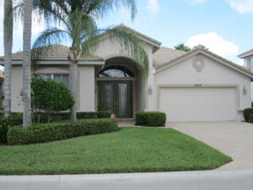 SWEEPING LAKE VIEW. Designed for entertaining!  Open floor plan with formal and informal dining area, great room, and a spacious den with cherry custom built-ins. Tile floors through out the living areas. The gourmet kitchen also has beautiful cherry cabinets and is surrounded by granite counter tops, a center cook's island, pantry, oven, a microwave/convection oven, and a desk area.  The large covered patio, screen enclosed pool with spa and cabana bath is in the Master Bedroom.  Speakers on the lanai, Master Bedroom and den add to the lengthy list of upgrades in the this home.  There is a large extra storage closet and the home is protected completely by accordion shutters.  Homeowner has provided a list of builder upgrades and recent upgrades that make this the perfect Florida home.