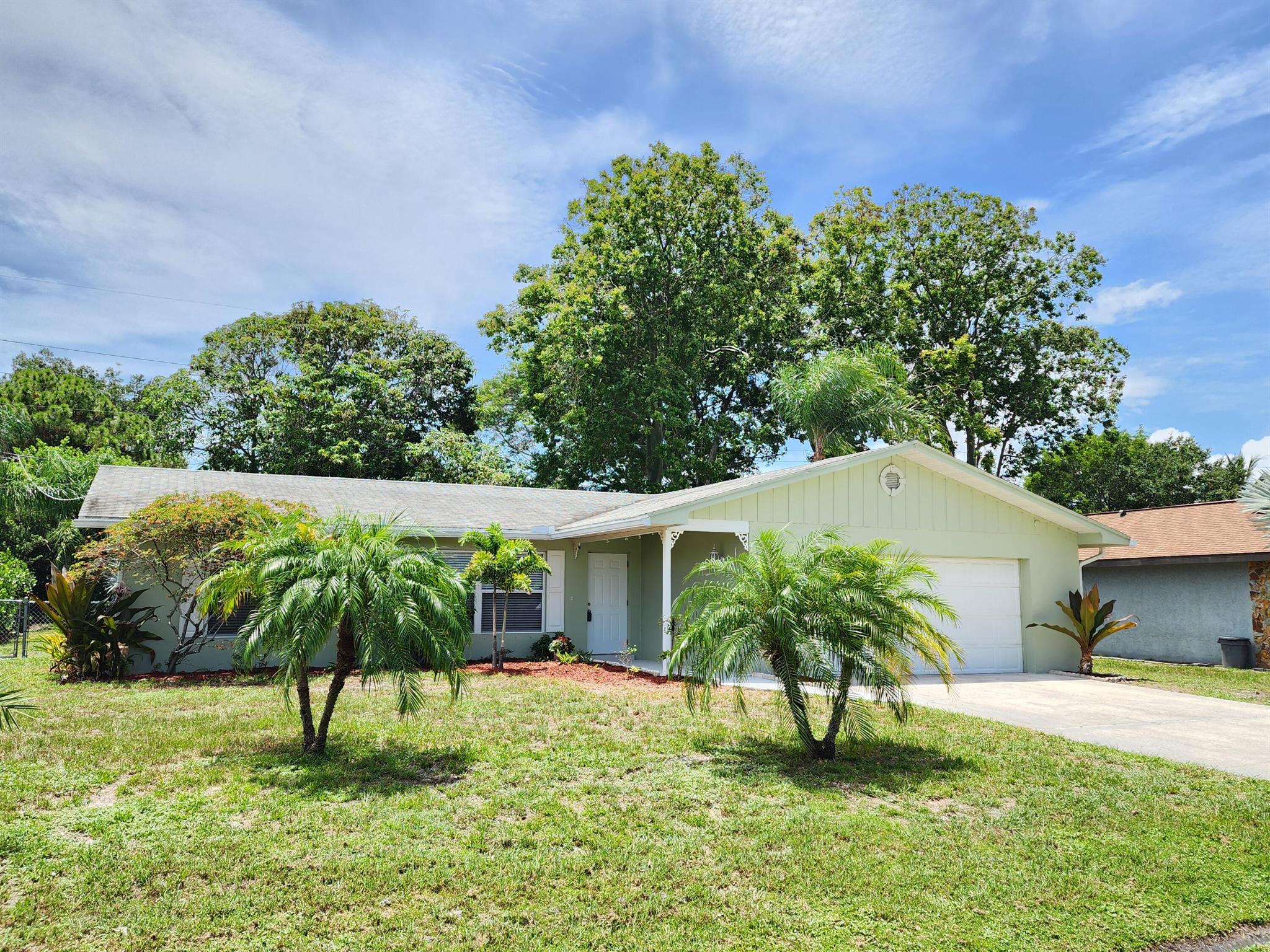 Cozy 2 BR 2 BA 2 CG rental in central PSL. Close to shopping and schools. Only minutes to the St Lucie Medical Center. Fenced backyard, screened porch, and tile throughout.. First, Last & Security required. Landlord would prefer no pets....Available 9/1/25.