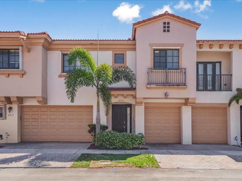 STUNNING AND MODERN 3-bed, 2.5-bath townhouse located in the exclusive Grand Cypress community in Coconut Creek. Home features a remodeled kitchen, new luxury vinyl flooring throughout, and a brand-new water heater. The two full bathrooms have been renovated, custom walk-in closets. Fresh paint brightens the entire home, new led lighting throughout, updated electrical outlets, whole house water filtration system. Cozy loft, full size laundry room with a sink and a spacious two-car garage. Private patio with open fencing and pleasant views. Well-maintained community with pool and playground. With easy access to the Sawgrass expressway, Turnpike. Close to dinning, shopping and entertainment! The association does not have a minimum down payment required!