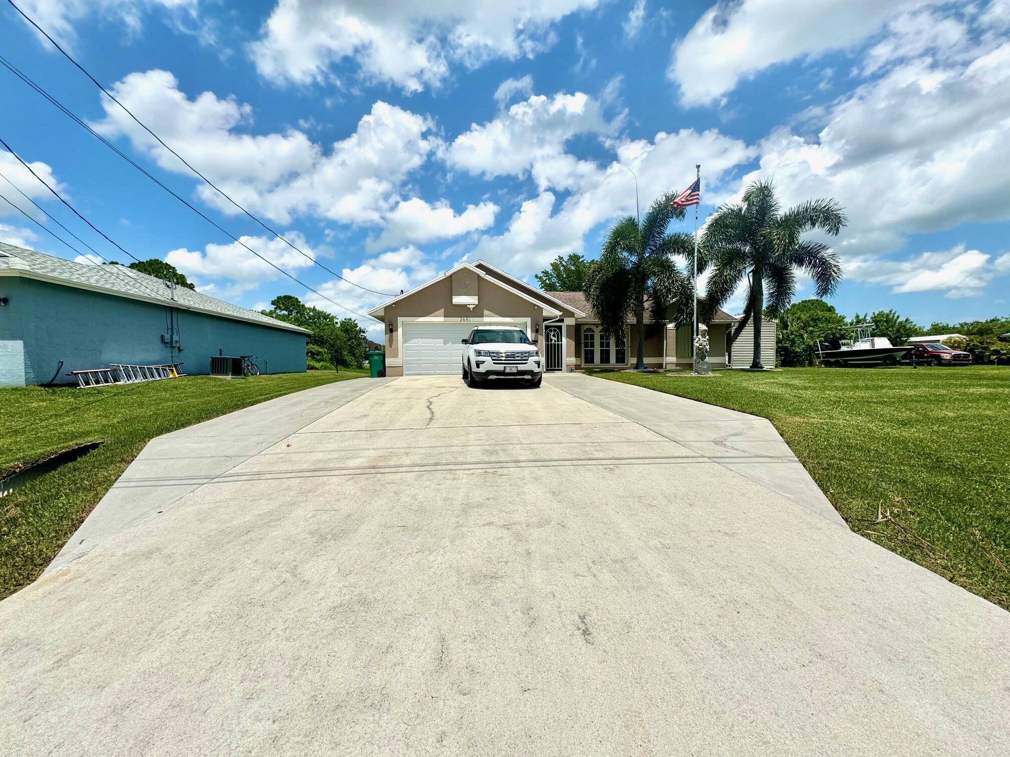 This large 3 bedroom, 2 bath, heated pool home sits on a dead-end street and overlooks a large lake. Privacy and family friendly are a 10 out of 10 for this property. Sitting just outside of the Tradition area, you get all the perks of Tradition, Gatlin, and St. Lucie West without the traffic. This home just appraised for well over asking, making the move even more enticing by coming in with tons of equity. The house features granite, tile throughout, screened back patio, and large shed on the property. Don't miss out of this well kept, clean, and spacious home.