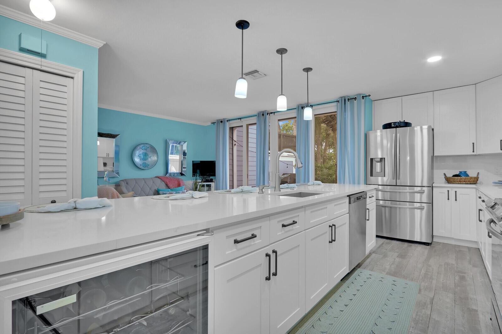 Beautifully remodeled 3BR/2.5BA townhouse in Ocean Dunes, just two blocks from the beach. This move-in ready home features shiplap accents, wainscoting, and stylish upgrades throughout. Recent renovations include a new roof, impact windows (full storm protection), stunning kitchen with 2024 appliances, updated master bath, fresh interior/exterior paint, plank tile flooring, new washer/dryer, and maintenance-free front decking. Enjoy resort-style amenities in this gated community: renovated pool & spa, tennis, pickleball, basketball, bocce, and handball. Pet-friendly, near Jupiter's dog beach, with Juno Pier, Publix, restaurants, and shops all within walking distance.