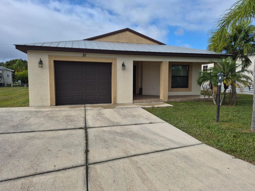 Photo of 31 S Alhambra Lane, Port Saint Lucie, FL 34952 (MLS # R11148413)