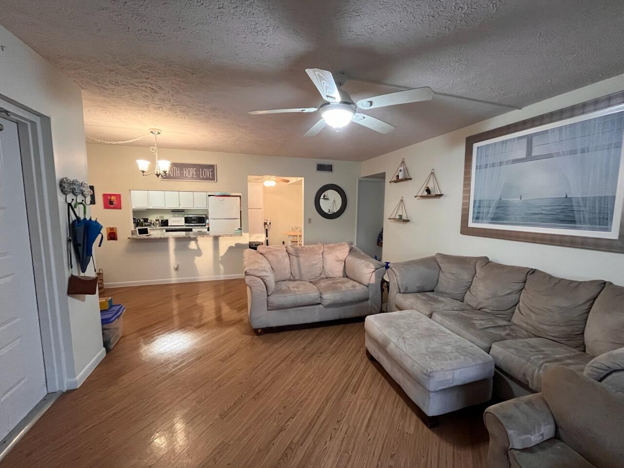 Available May 1. Easy care vinyl floors throughout. Remodeled kitchen with granite counters. Convenient first floor location looking at the lake fountain. One assigned parking space, with plenty of guest parking. Mailbox is steps away. Pine Ridge is a quiet complex with numerous lakes and sidewalks in the heart of Palm City. This unit is managed locally by the owner who makes repairs quickly. Includes clubhouse and pool access. Construction is concrete block and poured concrete ceiling, making it very quiet. Current tenant is moving out by the end of April. Kitchen will feature all new cabinets and microwave over stove.