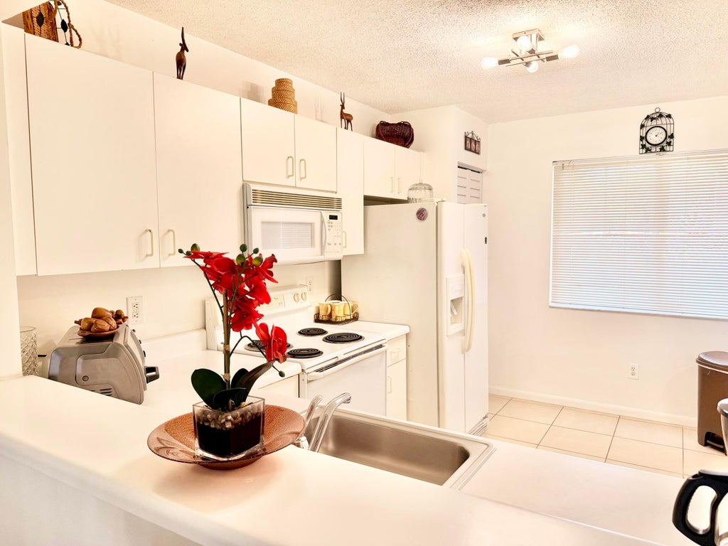 Photo of 9511 WELDON Circle #G108, Tamarac, FL 33321 (MLS # B26077899)