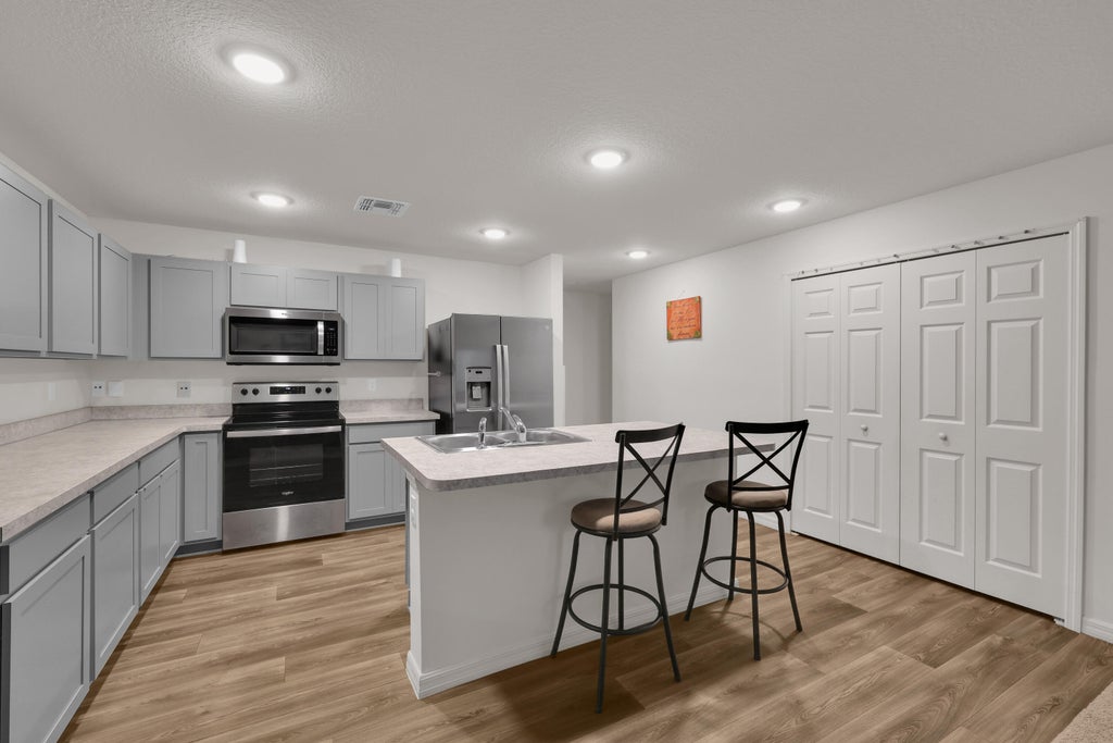 Photo of 1950 SW Diamond Street, Port Saint Lucie, FL 34953 (MLS # B26080481)