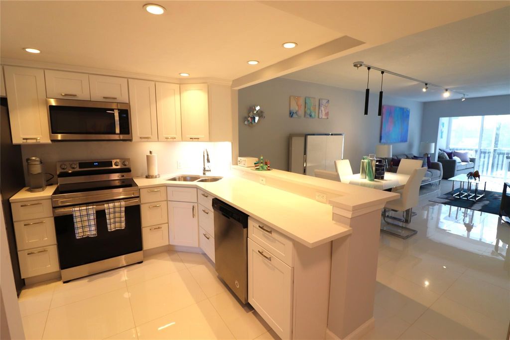 Photo of 3200 N Palm Aire Dr #207, Pompano Beach, FL 33069 (MLS # F10408254)
