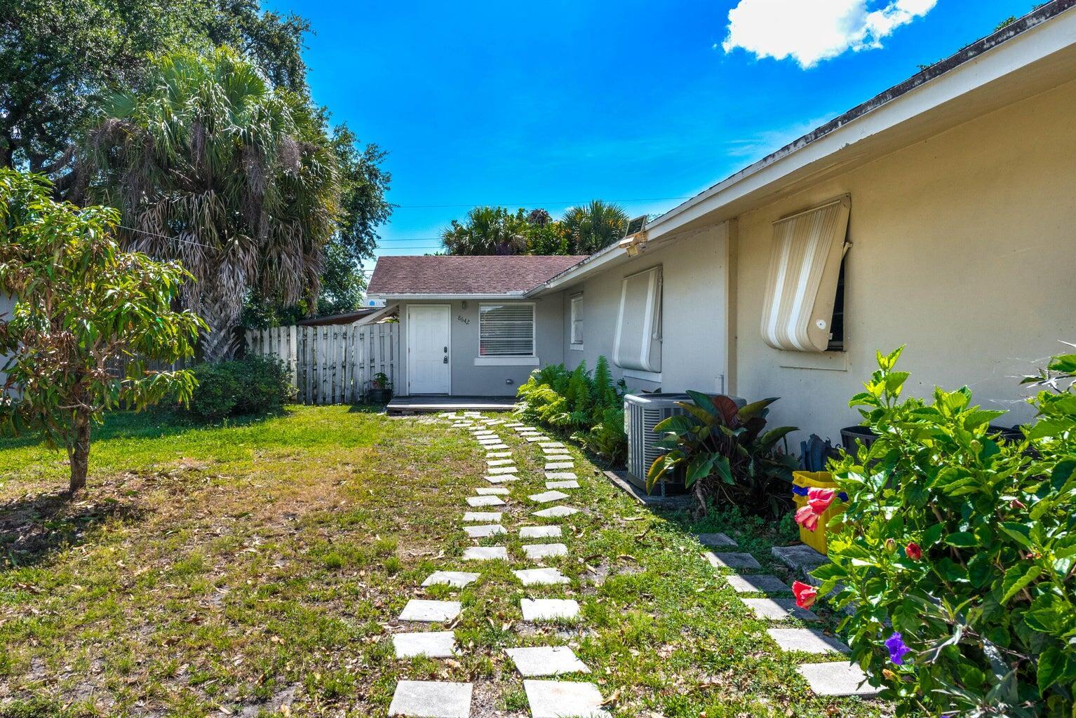 Discover this spacious 2-bedroom, 1-bathroom home featuring a renovated kitchen with stainless steel appliances, a beautifully updated bathroom, and a generous backyard--perfect for relaxing or entertaining. The property also includes parking for up to 2 cars.Location: Centrally situated off North Lake Blvd., just minutes from I-95, supermarkets, shopping plazas, restaurants, natural parks, PGA, Palm Beach Outlets, and the beach.
