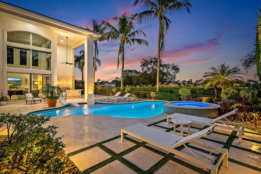 Newly renovated paradise set on an exceptional golf & lakefront lot overlooking the renowned 17th hole. A breathtaking backdrop enhances everyday living, with clean lines & stylish  inviting spaces is ideal for both intimate gatherings & large-scale entertaining. Thoughtfully transformed with no detail overlooked, the home features a recently replaced roof, fully remodeled bedrooms & bathrooms, updated HVAC, impact glass, & a state-of-the-art lighting system with remote access throughout.The chef's kitchen, has been completely remodeled with top-of-the-line appliances, elevating the entertaining experience. The first-floor primary suite offers expansive golf & lake views, an oversized luxurious spa-like bath with an elegant sitting area. Outdoor living has been thoughtfully enhanced with a remodeled pool, spa, patio, enhanced lighting, & new garage doors. The house also includes a full house generator. 
Residents enjoy world-class amenities including an Arnold Palmer signature golf course, pickleball, tennis, resort-style pool, & fitness center. The elegant clubhouse offers fine dining options & year-round social events, enriching the vibrant community lifestyle. Ideally located near pristine beaches, world-class shopping, fine dining, & PBI Airport, this exceptional residence delivers the perfect blend of luxury, comfort, & convenience.